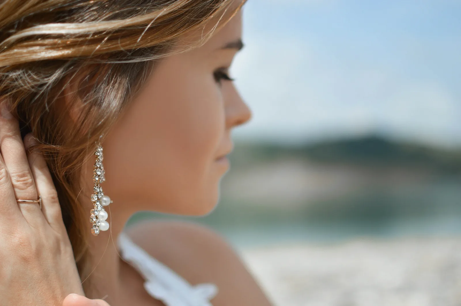 woman showing her earrings - Earring Photography