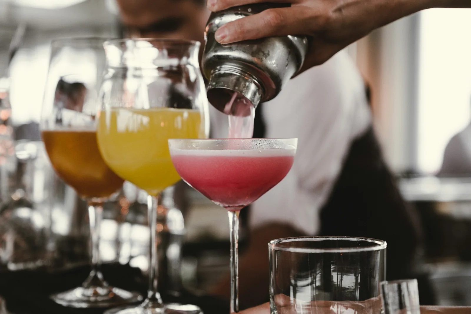 man pouring cocktails - Cocktail Photography