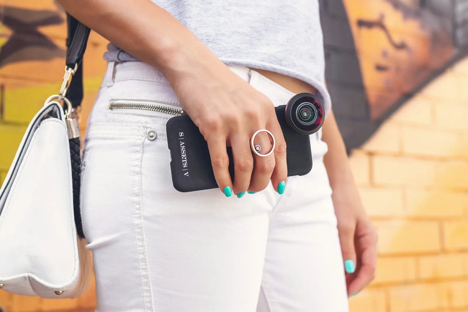 person with camera - How to Take Pictures of Jewelry With a Phone