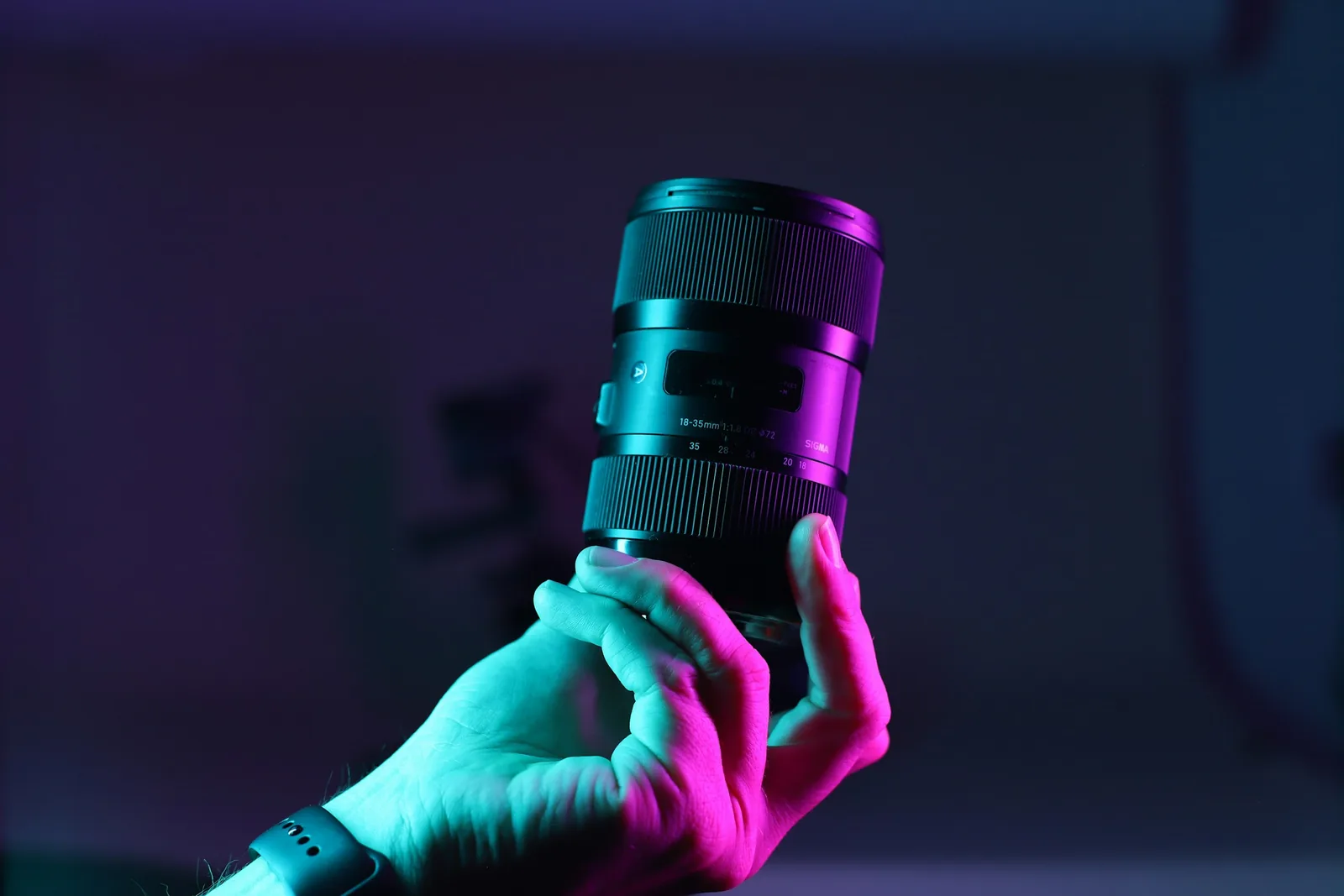 Person Holding Camera Lens - Best Lens for Jewelry Photography