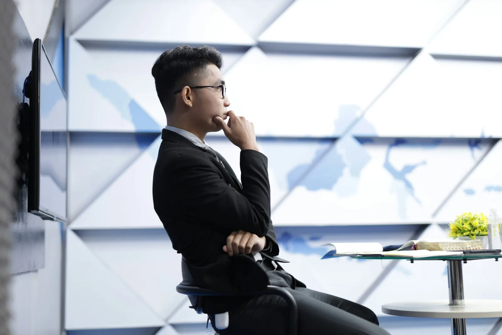 man thinking sitting on a chair - Product Photography Pricing