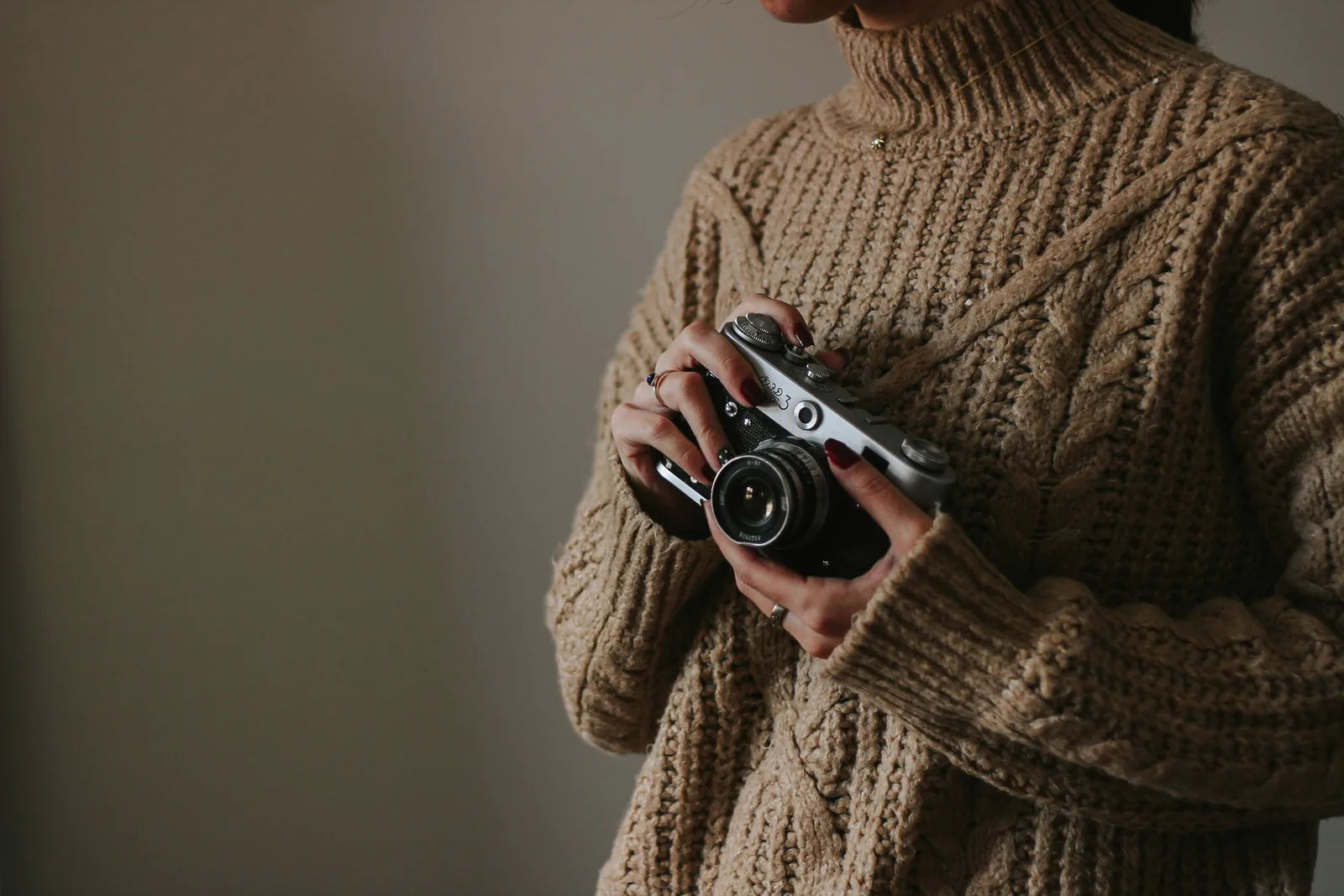 woman with camera - How To Take Pictures Of Clothes To Sell Online