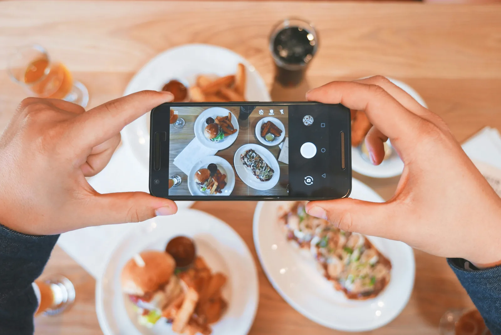 person taking picture of food - Food Photography Props