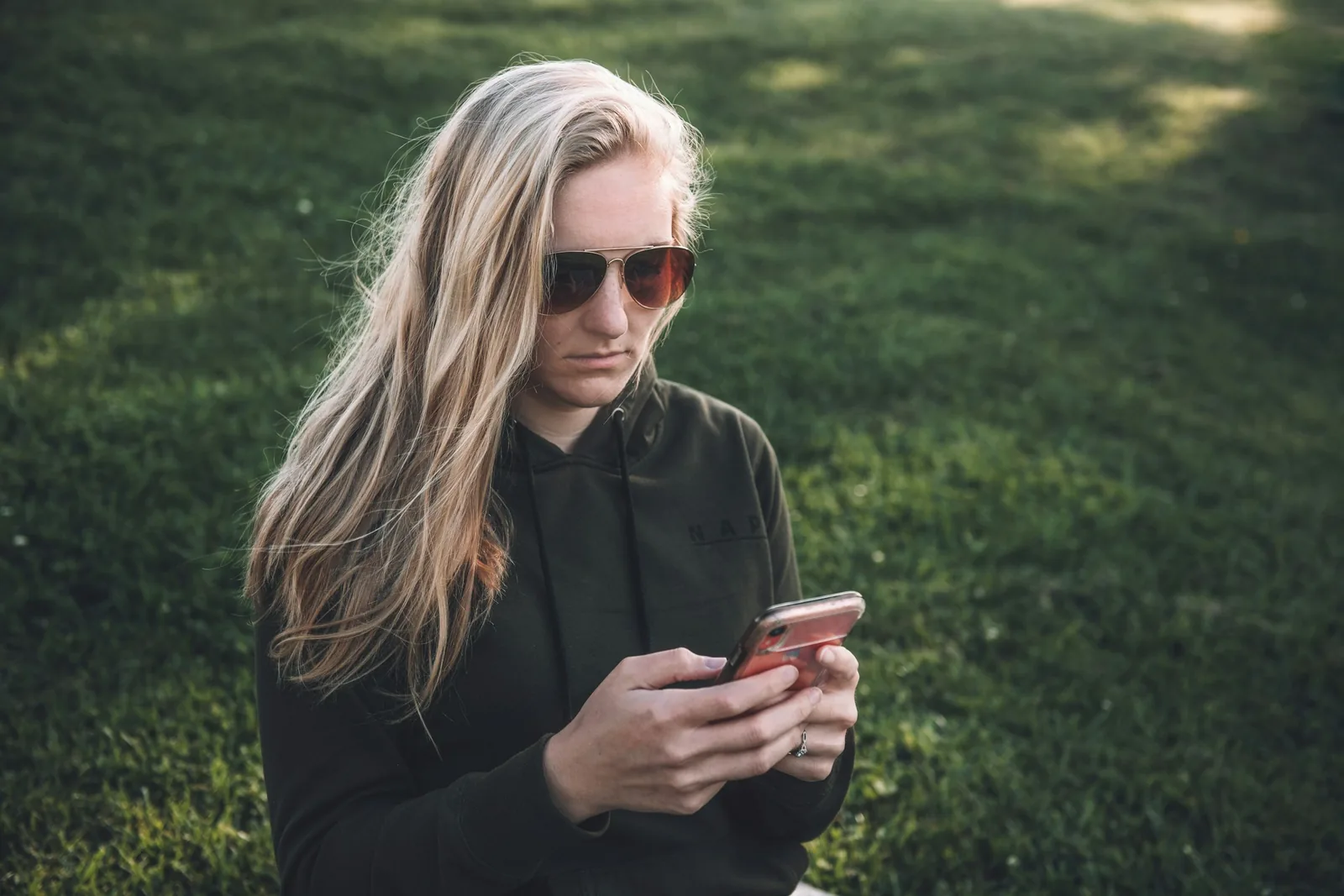 person typing on phone -vUse AI for Product Photography
