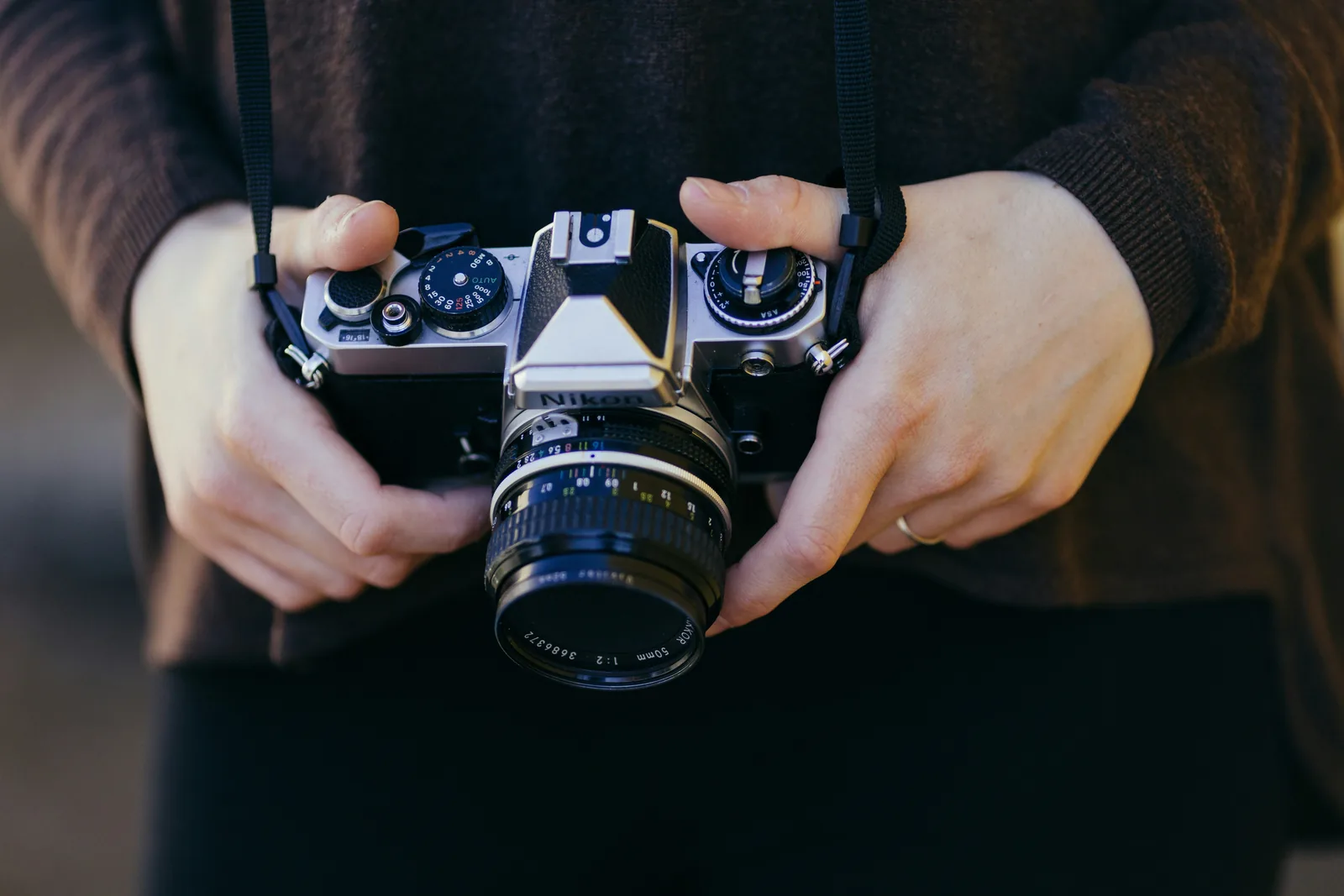 person holding camera - How To Shoot Product Photography