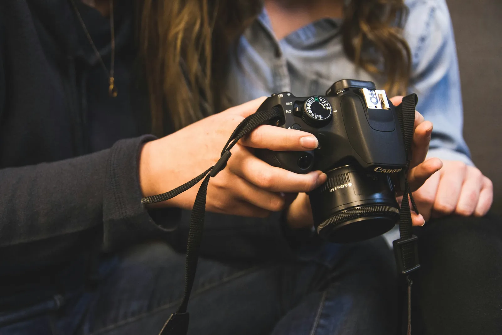 person checking results - Best Camera For Product Photography