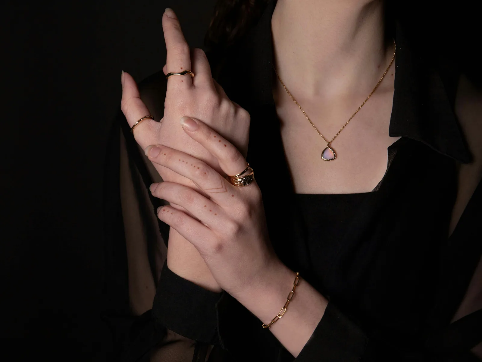 person showing off her jewels - How to Take Pictures of Jewelry With a Phone